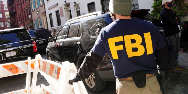 FBI agents block access to the street during the U.S. law enforcement's raid on Russian oligarch Oleg Deripaska's property in Manhattan, New York City, New York.