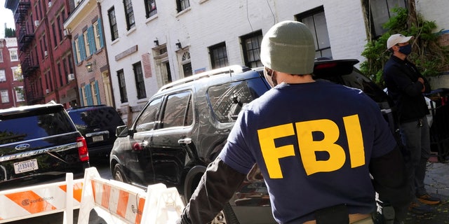 FBI agents block access to the street during the U.S. law enforcement's raid on Russian oligarch Oleg Deripaska's property in Manhattan, New York City, New York.