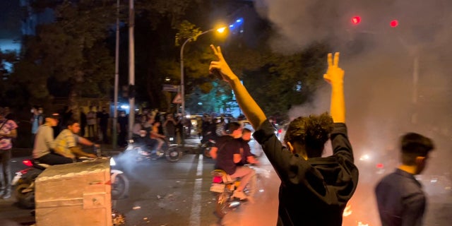 A man gestures during a protest over the death of Mahsa Amini, a woman who died after being arrested by the Islamic republic's "morality police", in Tehran, Iran September 19, 2022. WANA (West Asia News Agency) via REUTERS ATTENTION EDITORS - THIS IMAGE HAS BEEN SUPPLIED BY A THIRD PARTY.   ATTENTION EDITORS - THIS PICTURE WAS PROVIDED BY A THIRD PARTY