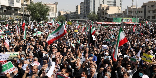 Pro-government peoples rally against recent protest rallies in Iran after Friday prayer ceremony in Tehran, Iran, September 23, 2022. Iranians staged mass protests over the case of Mahsa Amini, 22, who died last week later. being arrested by the moral police to wear "unsuitable clothing".