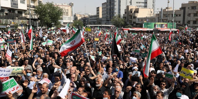 Pro-government peoples rally against recent protest rallies in Iran after Friday prayer ceremony in Tehran, Iran, September 23, 2022. Iranians staged mass protests over the case of Mahsa Amini, 22, who died last week later. being arrested by the moral police to wear "unsuitable clothing".