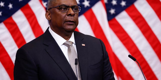 Defense Secretary Lloyd Austin attends a press conference at a NATO defense ministers meeting in Brussels on October 12, 2022.