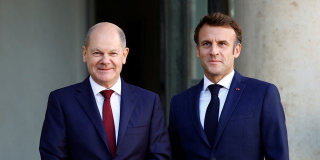 French President Emmanuel Macron welcomes German Chancellor Olaf Scholz to the Elysee in Paris, October 26, 2022.