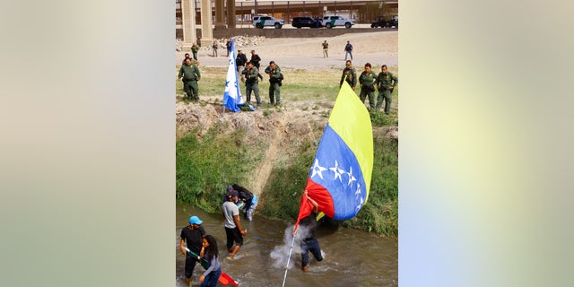 U.S. Border Patrol agents fire rubber bullets at Venezuelan migrants returning to Mexico down the Rio Bravo after crossing into the United States during a protest against new immigration policies, seen from Ciudad Juarez, Mexico October 31, 2022.