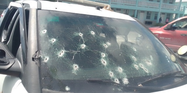A police car was damaged during a shootout with suspects, who used automatic weapons against officers.