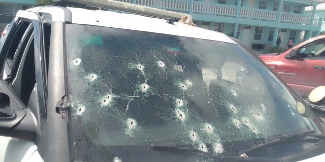 A police car was damaged during a shootout with suspects, who used automatic weapons against officers.