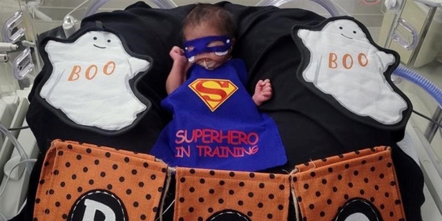 Pictures show the babies in adorable miniature costumes, including superheroes and Disney characters.