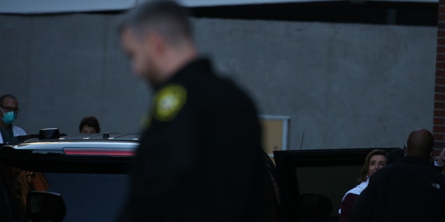 House Speaker Nancy Pelosi, D-Calif., (right) enters the Zuckerberg San Francisco General Hospital on Sunday after her husband was attacked inside their home. 