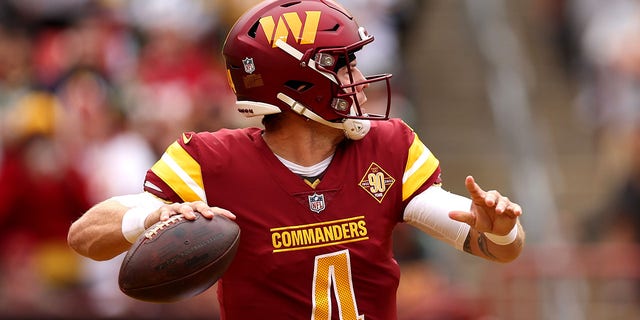 Taylor Heinicke, #4 of the Washington Commanders, throws the ball during the first quarter of the game against the Green Bay Packers at FedExField on Oct. 23, 2022 in Landover, Maryland.