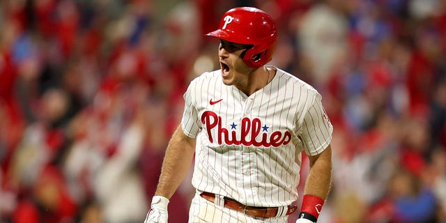 J.T. Realmuto #10 of the Philadelphia Phillies reacts after his solo home run during the seventh inning against the San Diego Padres in game four of the National League Championship Series at Citizens Bank Park on October 22, 2022 in Philadelphia, Pennsylvania.
