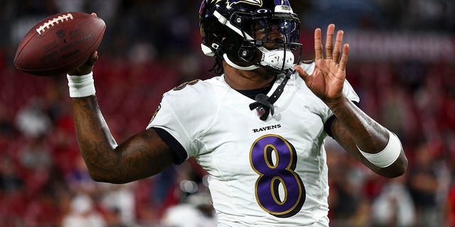 Lamar Jackson #8 of the Baltimore Ravens warms up prior to an NFL football game against the Tampa Bay Buccaneers at Raymond James Stadium on October 27, 2022 in Tampa, Florida.