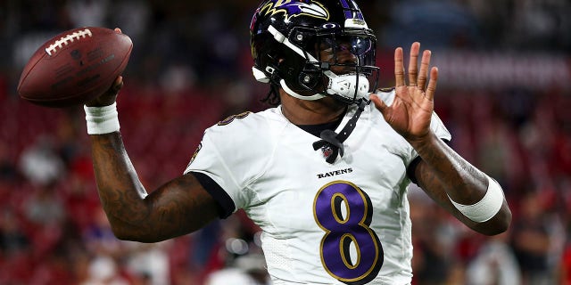 Lamar Jackson #8 of the Baltimore Ravens warms up prior to an NFL football game against the Tampa Bay Buccaneers at Raymond James Stadium on October 27, 2022 in Tampa, Florida.