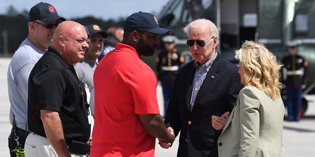 President Biden and first lady Jill Biden are greeted by Rep. Byron Donalds, R-Fla., upon arrival at Southwest Florida International Airport in Fort Myers, Florida, on Oct. 5, 2022.