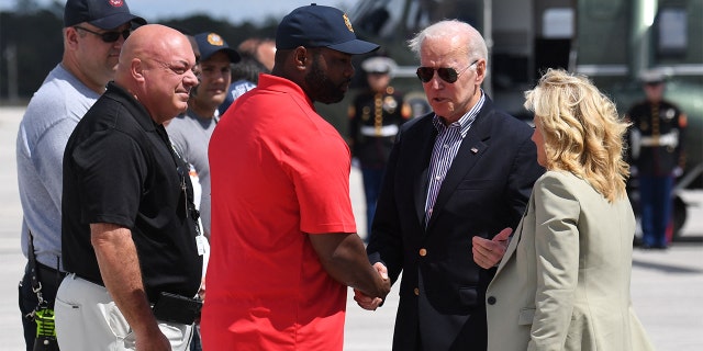 President Biden and first lady Jill Biden are greeted by Rep. Byron Donalds, R-Fla., upon arrival at Southwest Florida International Airport in Fort Myers, Florida, on Oct. 5, 2022.