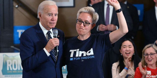 President Biden speaks alongside Tina Kotek, the Democratic nominee for governor of Oregon, during an Oregon Democrats grassroots phone banking event at SEIU Local 49 in Portland, Oregon, Oct. 14, 2022.