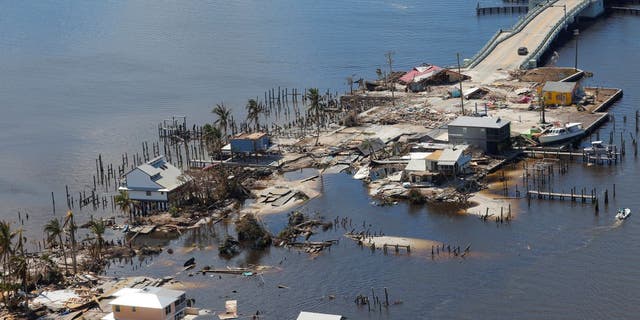 Destroyed homes and businesses on Pine Island, Florida are seen from a U.S. Army National Guard Blackhawk helicopter as U.S. National Guard Bureau Chief General Daniel Hokanson tours the area by air after Hurricane Ian caused widespread destruction in Pine Island, Florida, U.S., October 1, 2022.