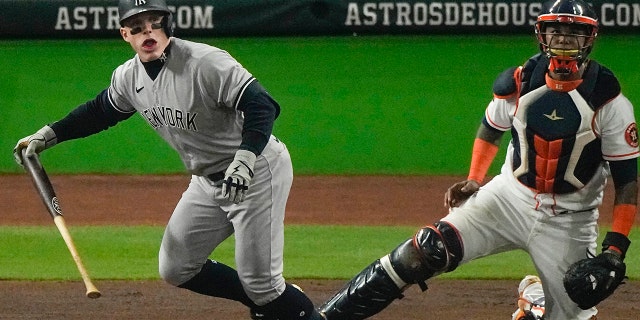 New York Yankees midfielder Harrison Bader (22) watches his solo home run during the second inning in Game 1 of baseball's American League Championship Series between the Houston Astros and the New York Yankees on Wednesday, October 19, 2022, in Houston.
