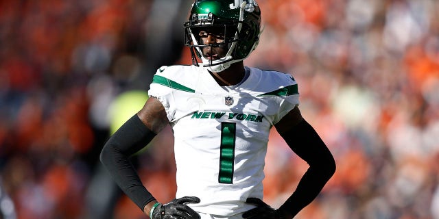 Sauce Gardner #1 of the New York Jets looks on during an NFL football game between the Denver Broncos and the New York Jets at Empower Field At Mile High on October 23, 2022 in Denver, Colorado.