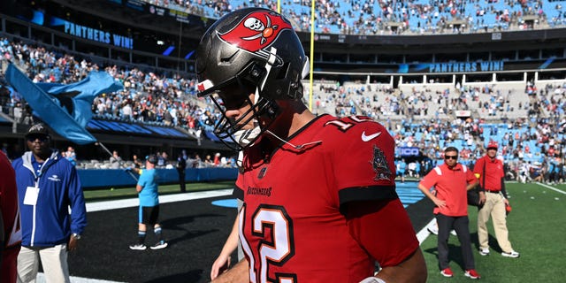 Tom Brady #12 of the Tampa Bay Buccaneers leaves the field after a loss to the Carolina Panthers at Bank of America Stadium on October 23, 2022, in Charlotte, North Carolina.