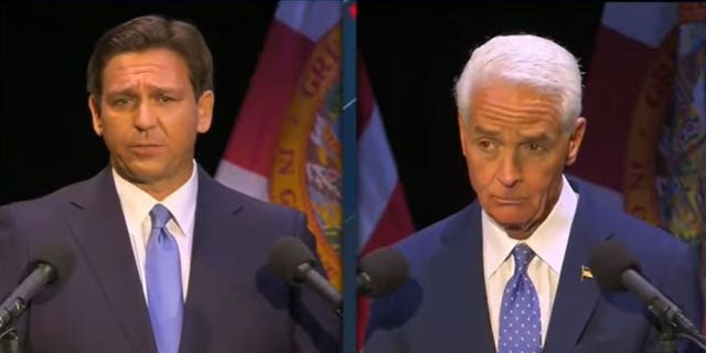 Republican Florida Gov. Ron DeSantis and former Democratic Congressman Charlie Crist participate in a live audience debate hosted  by local CBS affiliate WEPC on Oct. 24, 2022.