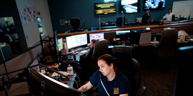 A dispatcher with the Anne Arundel County Fire Department answers a 911 emergency call in Glen Burnie, Maryland.
