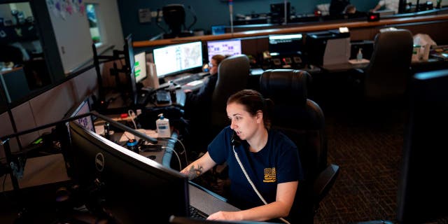 A dispatcher with the Anne Arundel County Fire Department answers a 911 emergency call in Glen Burnie, Maryland.
