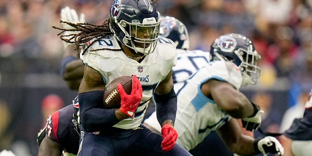 Tennessee Titans running back Derrick Henry runs 29 yards for a touchdown against the Houston Texans during the first half of a game Oct. 30, 2022, in Houston.