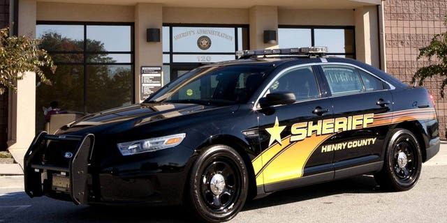 FILE- A police cruiser is seen outside the Henry County Sheriff's Office in McDonough, Ga. 