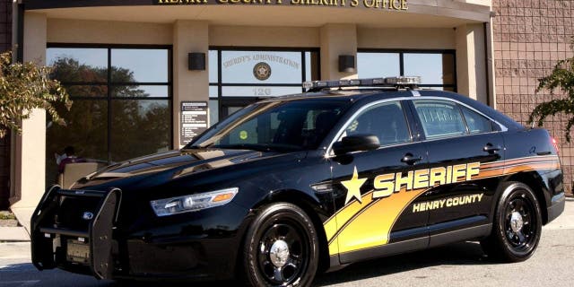 FILE- A police cruiser is seen outside the Henry County Sheriff's Office in McDonough, Ga. 