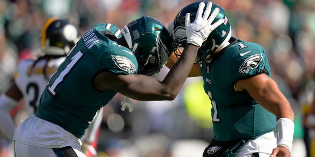 Eagles wide receiver A.J. Brown celebrates his third touchdown reception with quarterback Jalen Hurts during the Pittsburgh Steelers game, Sunday, Oct. 30, 2022, in Philadelphia.