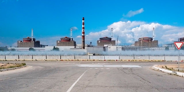 This photo of the flyer taken from a video and published by the press service of the Russian Ministry of Defense on August 7, 2022, shows a general view of the Zaporizhzhia nuclear power plant in the territory under Russian military control in southeastern Ukraine. 