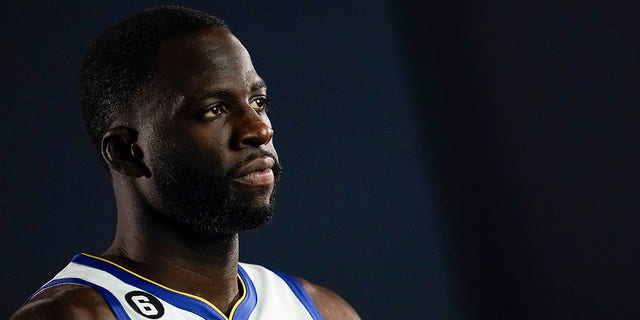 Golden State Warriors forward Draymond Green poses for a photograph during an NBA basketball media day in San Francisco, Sunday, Sept. 25, 2022. 