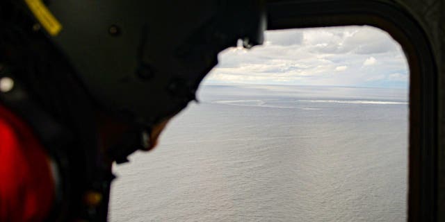 In this photo provided by the Armed Forces of Denmark, a helicopter crew monitors the gas leak in the Baltic Sea on Sept. 29, 2022.