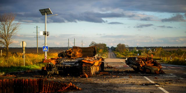 The remains of a destroyed Russian tank are scattered on the ground along the road between Izium and Kharkiv, Ukraine on Monday, October 3, 2022.