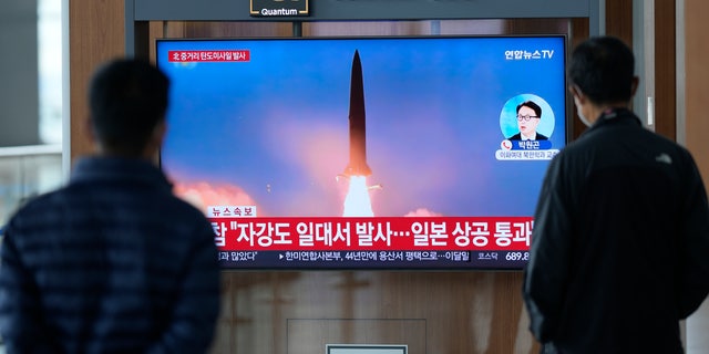 A TV screen showing a news program reporting about North Korea's missile launch with file image, is seen at the Seoul Railway Station in Seoul, South Korea, Tuesday, Oct. 4, 2022. 