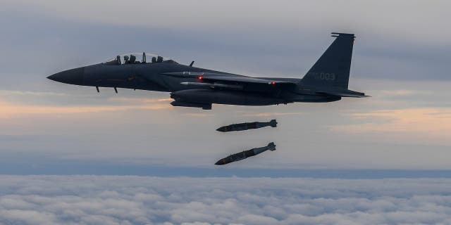 FILE - In this photo provided by South Korea Defense Ministry, South Korean Air Force's F15K fighter jet fires 2 JDAM (Joint Direct Attack Munition ) bombs into an island target in South Korea on Oct. 4, 2022.