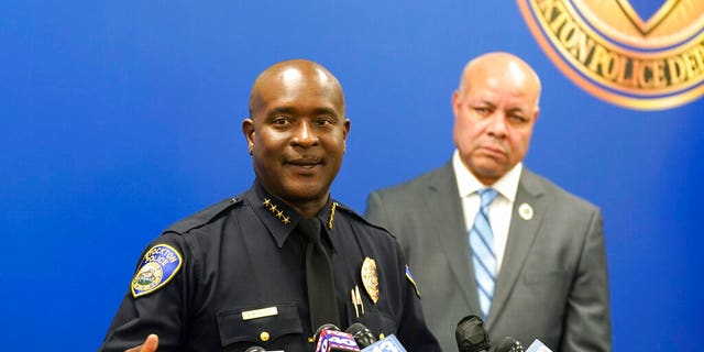Stockton Police Chief Stanley McFadden, left, flanked by Stockton City Manager Harry Black, updates reporters about the investigation into the fatal shooting of six men and the wounding of one woman during a news conference in Stockton, California, on Oct. 4, 2022.