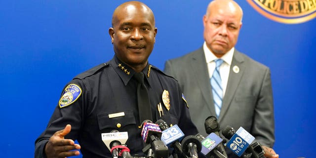 Stockton Police Chief Stanley McFadden, left, flanked by Stockton City Manager Harry Black, updates reporters about the investigation into the fatal shooting of six men and the wounding of one woman during a news conference in Stockton, California, on Oct. 4, 2022.