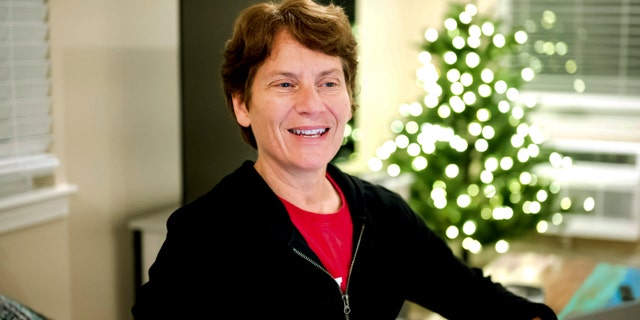 Stanford Professor Carolyn Bertozzi fields congratulatory emails shortly after learning she was awarded the Nobel Prize in chemistry on Wednesday, Oct. 5, 2022, in Palo Alto, Calif.