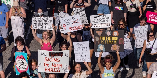 Hundreds of demonstrators march in downtown Raleigh, North Carolina on June 24, 2022.