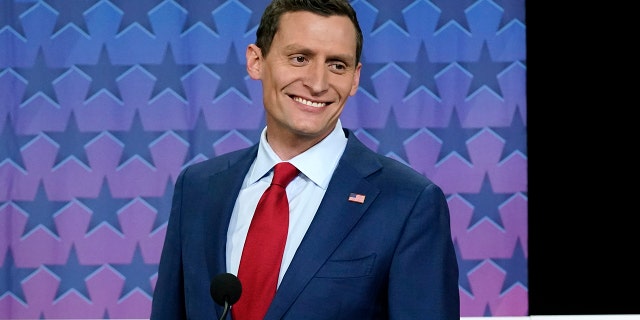 Republican Arizona Senator Blake Masters smiles on stage before a televised debate between Arizona Democratic Senator Mark Kelly and libertarian candidate Mark Victor on Thursday, October 6, 2022. 