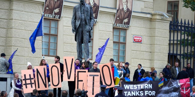 Protesters outside an EU summit in Prague, Czech Republic, on Friday, October 7, 2022, as European Union leaders converged on Prague Castle to bridge differences over a natural gas price cap as winter approaches and Russia's war on Ukraine fuels a major energy crisis. (AP Photo/Petr David Josek)