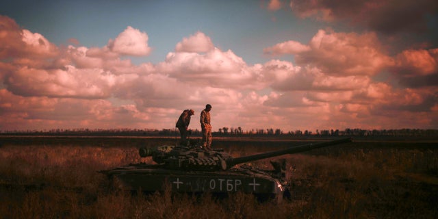 Ukrainian servicemen stand on top a Ukrainian tank near the recently retaken village of Borova, east Ukraine, Friday, Oct. 7, 2022.