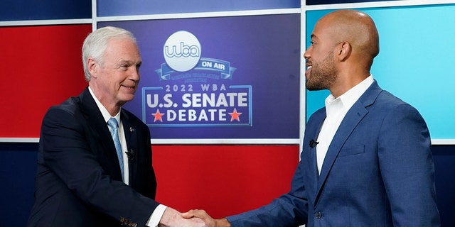 U.S. Sen. Ron Johnson, R-Wis., left, and his Democratic challenger Mandela Barnes shake hands before a televised debate, Friday, Oct. 7, 2022, in Milwaukee. 