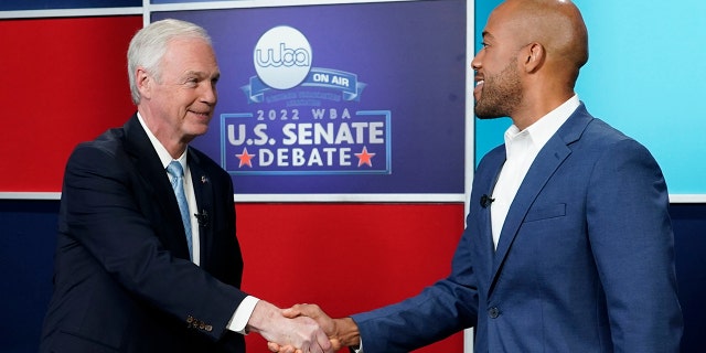 U.S. Sen. Ron Johnson, R-Wis., left, and his Democratic challenger Mandela Barnes shake hands before a televised debate, Friday, Oct. 7, 2022, in Milwaukee. 