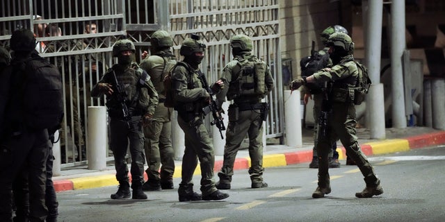 Israeli security forces patrol near the site of a shooting attack near the Shuafat refugee camp in Jerusalem, Saturday, October 8, 2022.