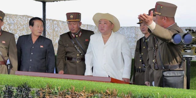 Kim Jong Un inspects military exercises at an undisclosed location in North Korea, Oct. 6, 2022.