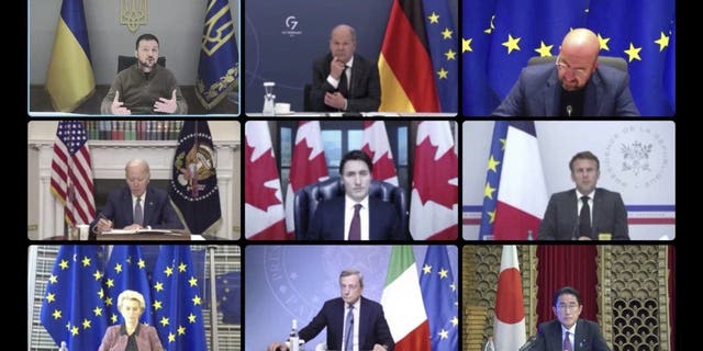 In this image from video provided by the Ukrainian Presidential Press Office, top from left: Ukrainian President Volodymyr Zelenskyy, German Chancellor Olaf Scholz, President of the European Council Charles Michel, second row from left, U.S. President Joe Biden, Canadian Prime Minister Justin Trudeau, France's President Emmanuel Macron, third row from left, European Commission President Ursula von der Leyen, Italy's Prime Minister Mario Draghi, Japanese Prime Minister Fumio Kishida and Britain's Prime Minister Liz Truss attend a video conference with G7 leaders and Ukraine, in Kyiv, Ukraine, Tuesday, Oct. 11, 2022. 