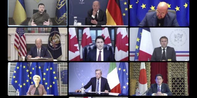 In this image from video provided by the Ukrainian Presidential Press Office, top from left: Ukrainian President Volodymyr Zelenskyy, German Chancellor Olaf Scholz, President of the European Council Charles Michel, second row from left, U.S. President Joe Biden, Canadian Prime Minister Justin Trudeau, France's President Emmanuel Macron, third row from left, European Commission President Ursula von der Leyen, Italy's Prime Minister Mario Draghi, Japanese Prime Minister Fumio Kishida and Britain's Prime Minister Liz Truss attend a video conference with G7 leaders and Ukraine, in Kyiv, Ukraine, Tuesday, Oct. 11, 2022. 