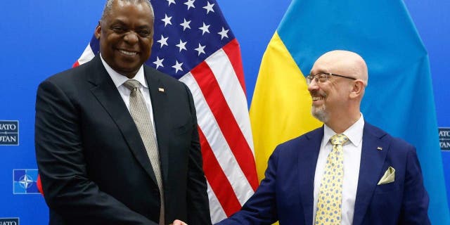 US Secretary of Defense Lloyd J. Austin III, right, shakes hand with Ukrainian Minister of Defense Oleksii Reznikov during a bilateral meeting ahead of a Meeting of the NATO Council Defense Ministers at the Alliance headquarters in Brussels, Wednesday, Oct. 12, 2022. 